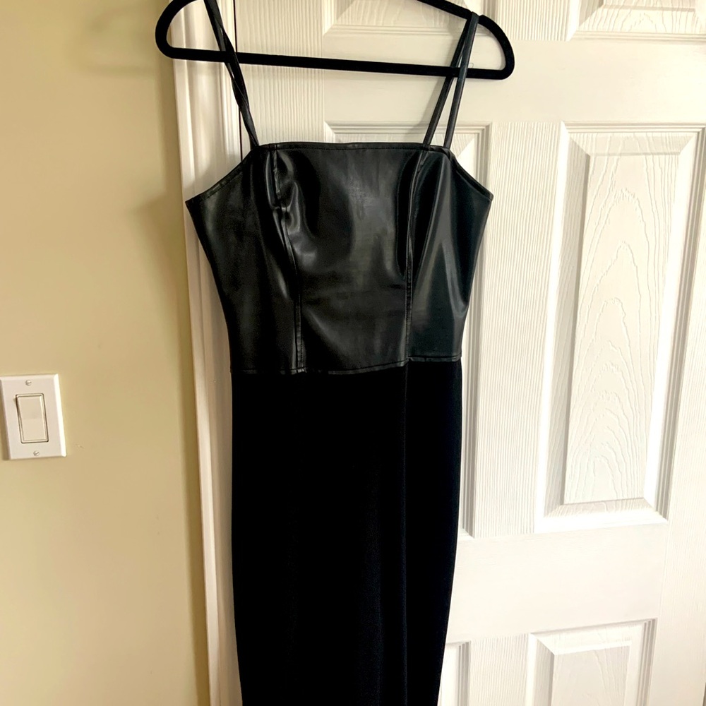 BOGO sexy black dress. Faux leather polyvinyl upper. Lower priced item is free